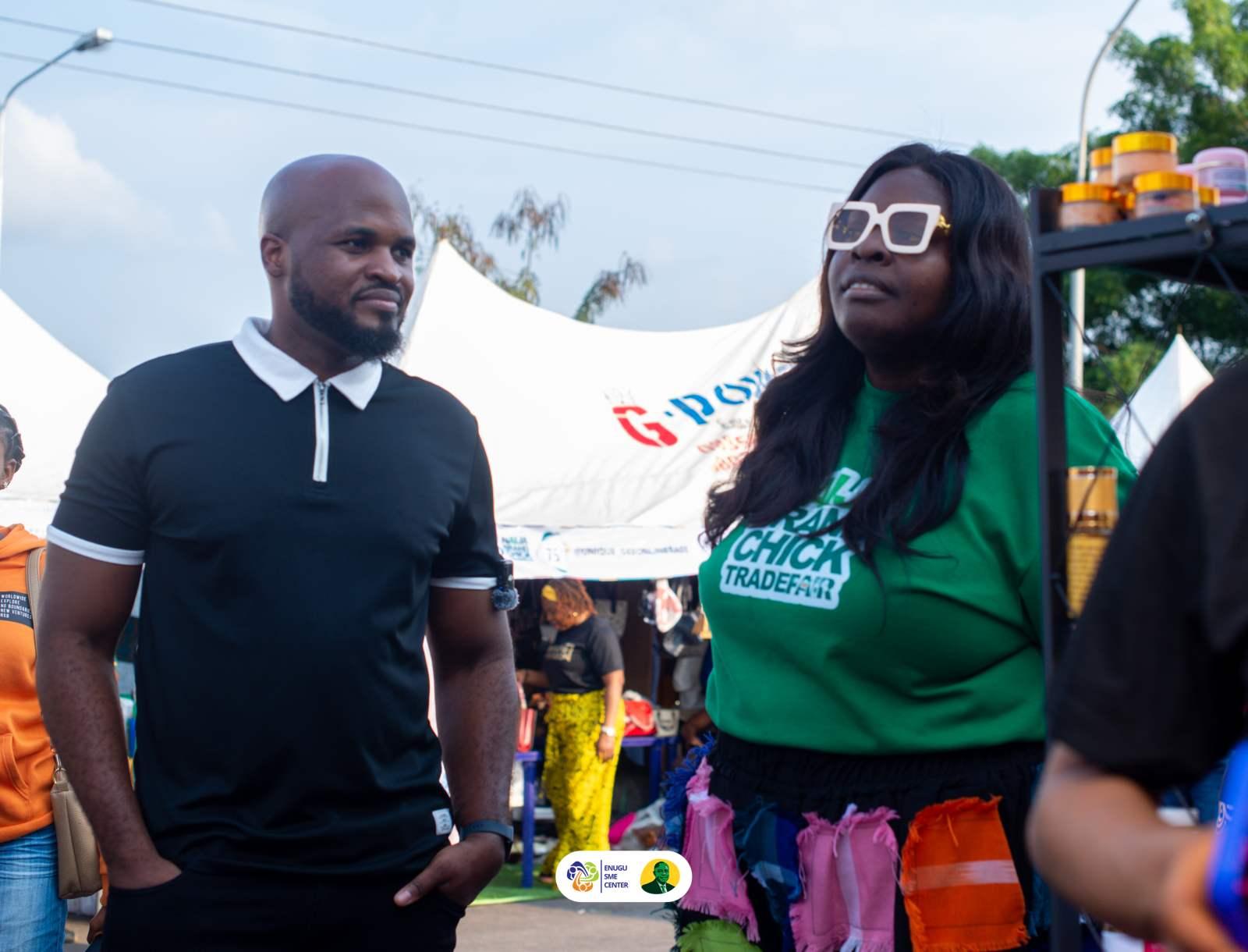 A vendor and customer at a trade-fair stall